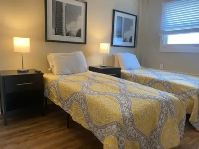 a hotel room with two beds and two lamps at Dayton with 6 Beds Sleeps 8 4 Bedrooms plus WIFI in Dayton