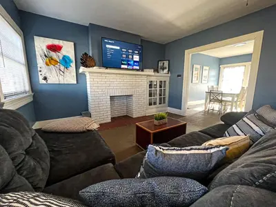 a living room with a couch and a fireplace at 3 Bedroom House, 7 Beds, Sleeps 10, Dayton in Dayton