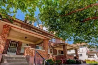 a brick house with a tree in front of it at 3 Bedroom House, 7 Beds, Sleeps 10, Dayton in Dayton