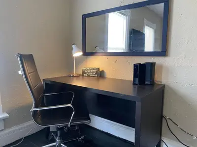 a desk with a chair and a mirror on a wall at Dayton with 5 Beds Sleeps 10 2 Bedrooms plus WIFI in Dayton