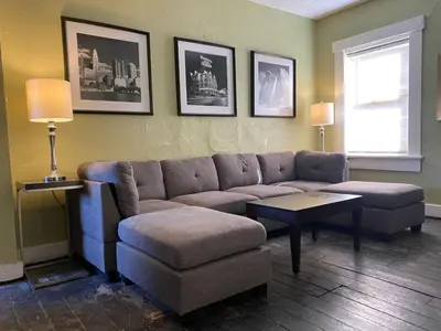 a living room with a couch and a chair and a table at Dayton with 5 Beds Sleeps 10 2 Bedrooms plus WIFI in Dayton