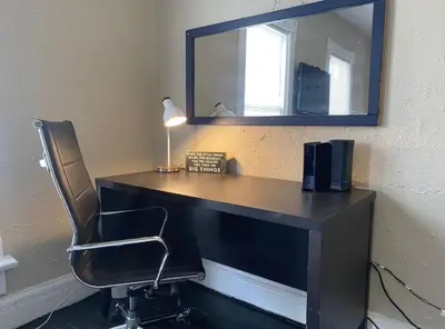 a desk with a chair and a mirror at Sleeps 16 with 11 Beds 6 Bedrooms plus WIFI in Dayton