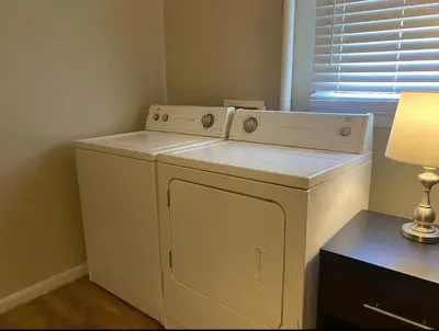 a white washer and dryer in a room at Sleeps 16 with 11 Beds 6 Bedrooms plus WIFI in Dayton
