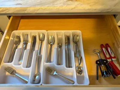 a tray of utensils sitting on a table at Spacious 4 bedroom Sleeps 8 with 7 Beds plus Parking in Dayton