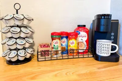 a shelf with coffee cups and a coffee maker at Spacious 4 bedroom Sleeps 8 with 7 Beds plus Parking in Dayton