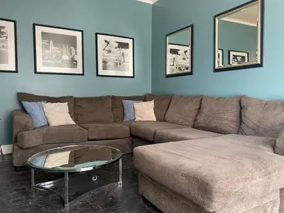 a living room with a couch and a coffee table at Rare Find Sleeps 16 with 9 Beds 6BR plus WIFI in Cincinnati