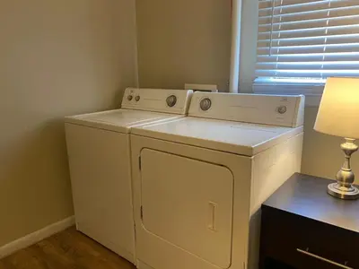 a white washer and dryer in a room at Crew Housing Sleeps 8 with 6 Beds plus 4 Bedrooms in Dayton