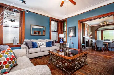 a living room with a couch and a coffee table at Downtown Mansion with 7 Bedrooms 2.5 Baths Sleeps 20 in Cincinnati