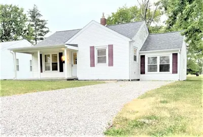 a white house with a driveway in front of it at Walnut - Family Neighborhood, Pet Friendly in Paulding