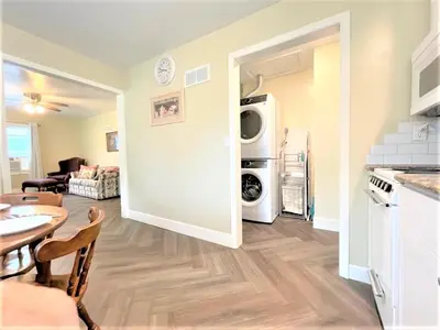 a kitchen and living room with a table and a microwave at Walnut - Family Neighborhood, Pet Friendly in Paulding