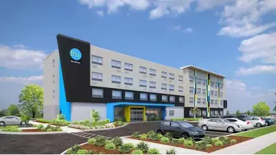 a rendering of a hotel with cars parked in a parking lot at Tru By Hilton Anderson in Anderson