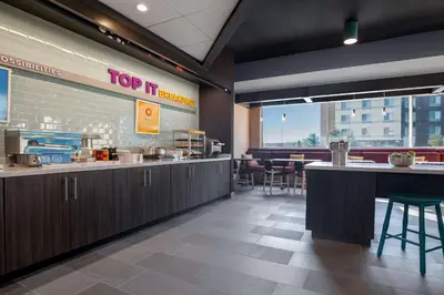a fast food restaurant with a top sqor sign on the wall at Tru By Hilton Anderson in Anderson
