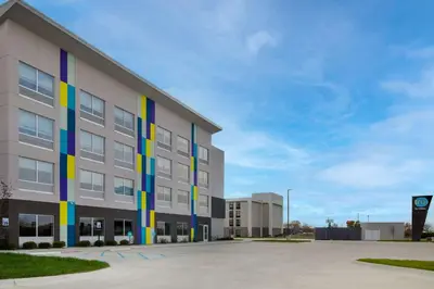 a building with colorful stripes on the side of it at Tru By Hilton Anderson in Anderson