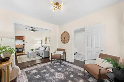 a living room with a couch and a table at Charming Home in Cleveland 3215 in Ohio City