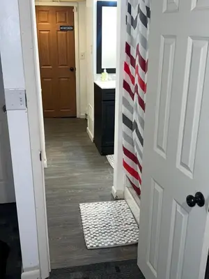 a hallway with an american flag on the door at The Haven in Toledo