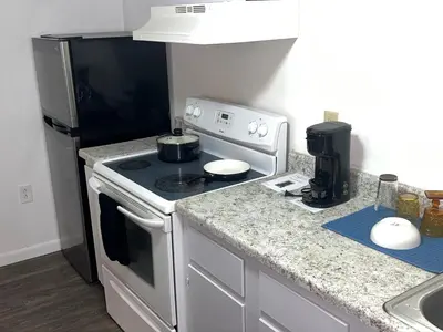a kitchen with a stove and a refrigerator at The Haven in Toledo