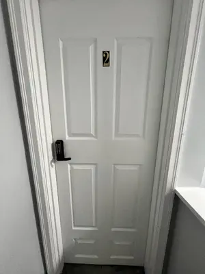 a white door with the number on it at Private Bedroom Suite 4 Cape Cod Cutie 10 Min to Downtown in Bromley