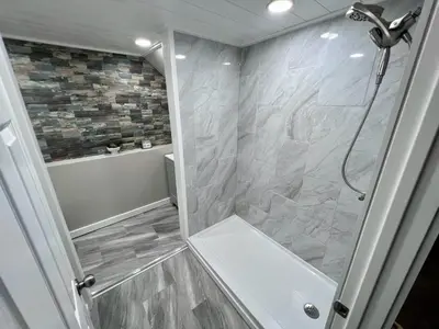 a bathroom with a shower with a glass door at Private Bedroom Suite 4 Cape Cod Cutie 10 Min to Downtown in Bromley