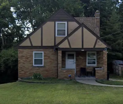 a small brick house with at Private Bedroom Suite 4 Cape Cod Cutie 10 Min to Downtown in Bromley