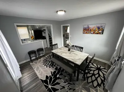 a dining room with a table and chairs at Private Bedroom Suite 4 Cape Cod Cutie 10 Min to Downtown in Bromley