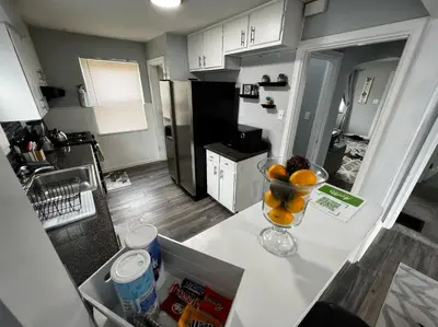 a kitchen with a bowl of fruit on a counter at Private Bedroom Suite 4 Cape Cod Cutie 10 Min to Downtown in Bromley