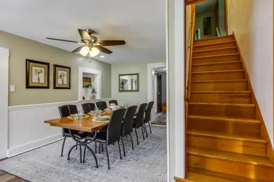 a dining room with a table and chairs at Grandma Kellys Southeast Indiana Farmhouse! in Cedar Grove
