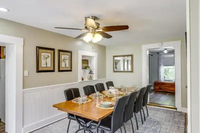 a dining room with a table and chairs at Grandma Kellys Southeast Indiana Farmhouse! in Cedar Grove
