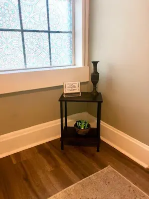 a small table in a room with a window at Eco Friendly Home by Cincy w Office Space in Dayton