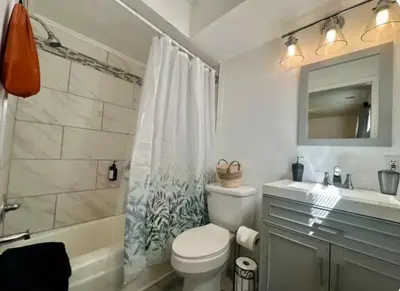 a bathroom with a toilet and a sink and a shower at Nationwide Childrens Hospital close by in Columbus