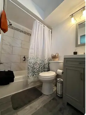 a bathroom with a toilet and a shower and a sink at Nationwide Childrens Hospital close by in Columbus