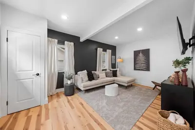 a living room with a couch and a table at Charming Home in Cleveland 3219 in Ohio City