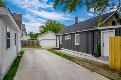 a house with a garage and a driveway at Charming Home in Cleveland 3219 in Ohio City