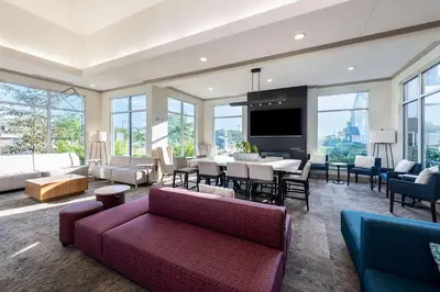 a living room with a couch and a table at The Hilton Garden Inn in Grove City