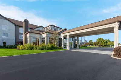 an empty driveway in front of a building at The Hilton Garden Inn in Grove City