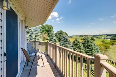 a balcony with chairs and a view of the countryside at Panoramic Views Hillside Millersburg Studio in Millersburg