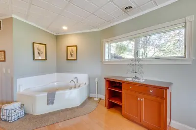 a large bathroom with a tub and a window at Holmes With a View Studio Millersburg Retreat! in Millersburg