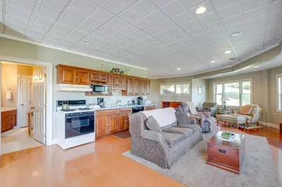 a kitchen and living room with a couch and a table at Holmes With a View Studio Millersburg Retreat! in Millersburg