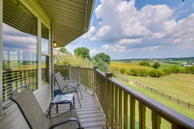 a porch with benches and a view of the countryside at about 4 Mi to German Market Millersburg Retreat in Millersburg