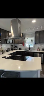 a kitchen with a white counter top in a kitchen at Very affordable Spacious private urban oasis in Cincinnati