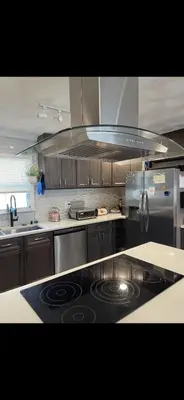 a kitchen with a stove top oven in a kitchen at Very affordable Spacious private urban oasis in Cincinnati