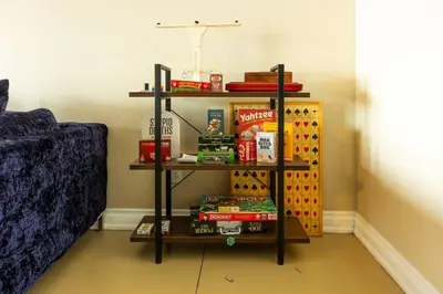 a room with a book shelf with books at RiverFront Landing in Rossford