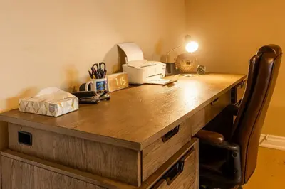 a desk with a printer on top of it at RiverFront Landing in Rossford
