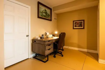 an office with a desk and a white door at RiverFront Landing in Rossford