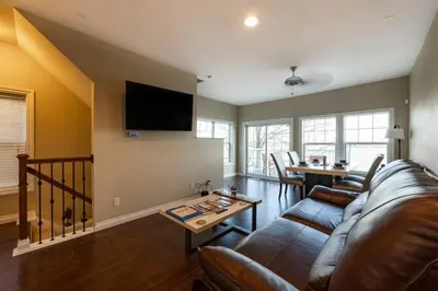 a living room with a couch and a table at RiverFront Landing in Rossford