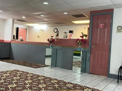a waiting room with a red door in a hospital at Value Stay in Winchester