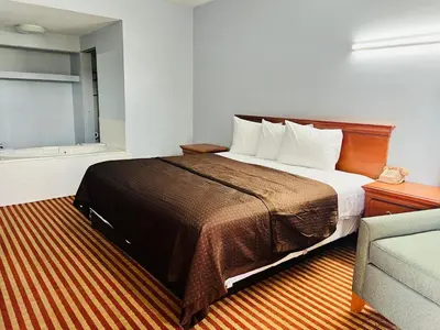 a hotel room with a bed and a couch at Value Stay in Winchester