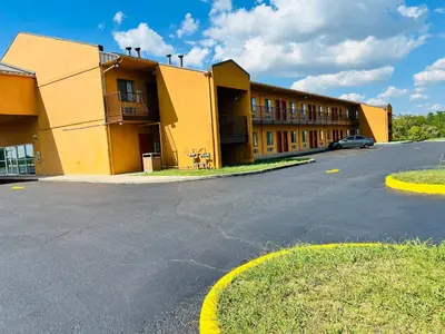 an empty parking lot in front of a building at Value Stay in Winchester