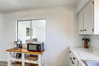 a kitchen with a desk with a microwave on it at Waterfront Port Clinton Cottage 5 Mi to Lake Erie in Port Clinton