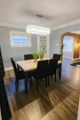 a dining room with a table and chairs at Spacious Three Bedroom Parma Home Sleeps six Near Cleveland in Parma