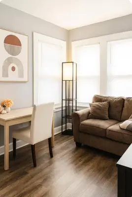 a living room with a couch and a table at Spacious Three Bedroom Parma Home Sleeps six Near Cleveland in Parma